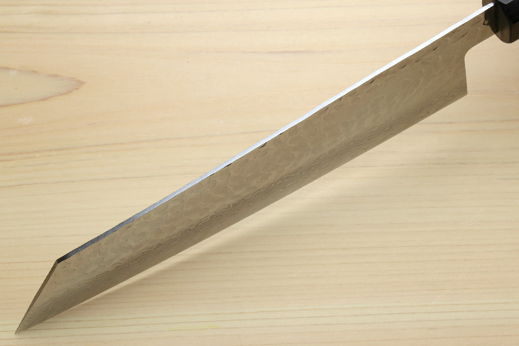 Kiritsuke chef knife blade edge and bevel with hammered Damascus pattern