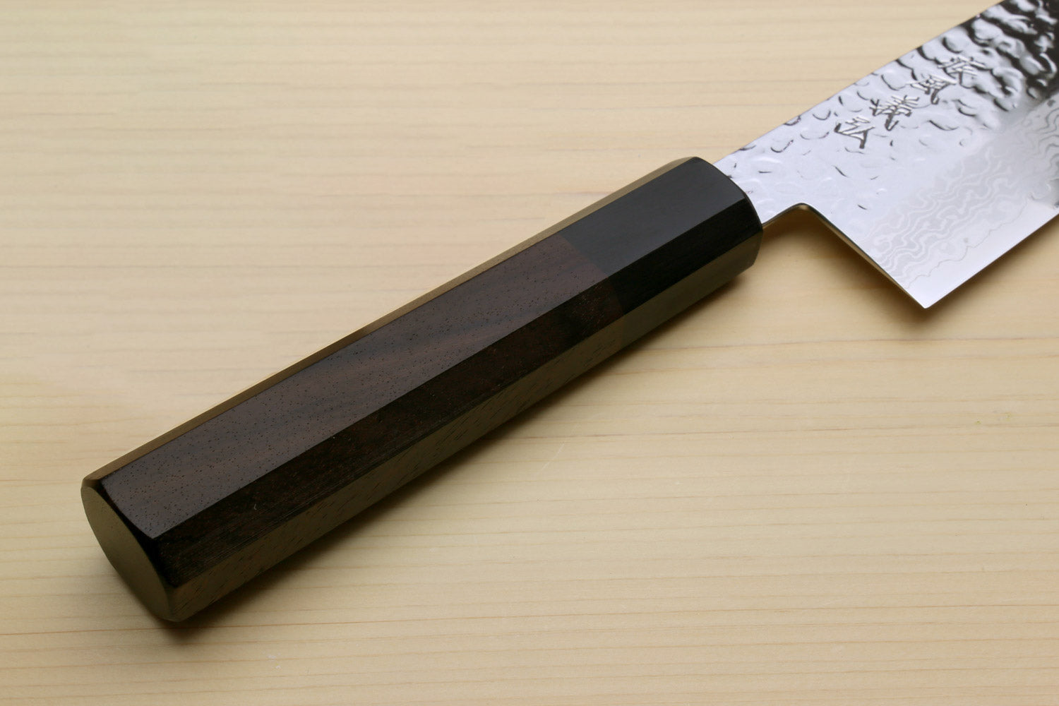 Kiritsuke chef knife handle and hammered Damascus blade with dark octagonal grip