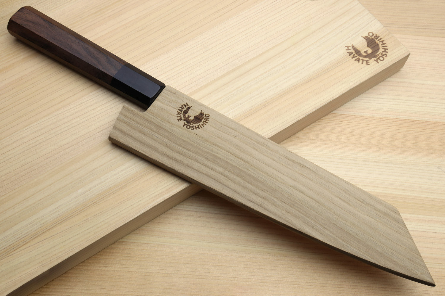 Kiritsuke chef knife with stainless blade and dark rosewood handle, in wooden sheath