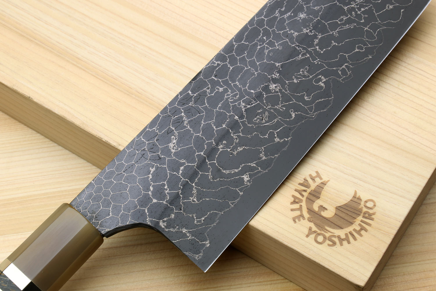 Nakiri vegetable knife angled view, dark Damascus blade and light handle