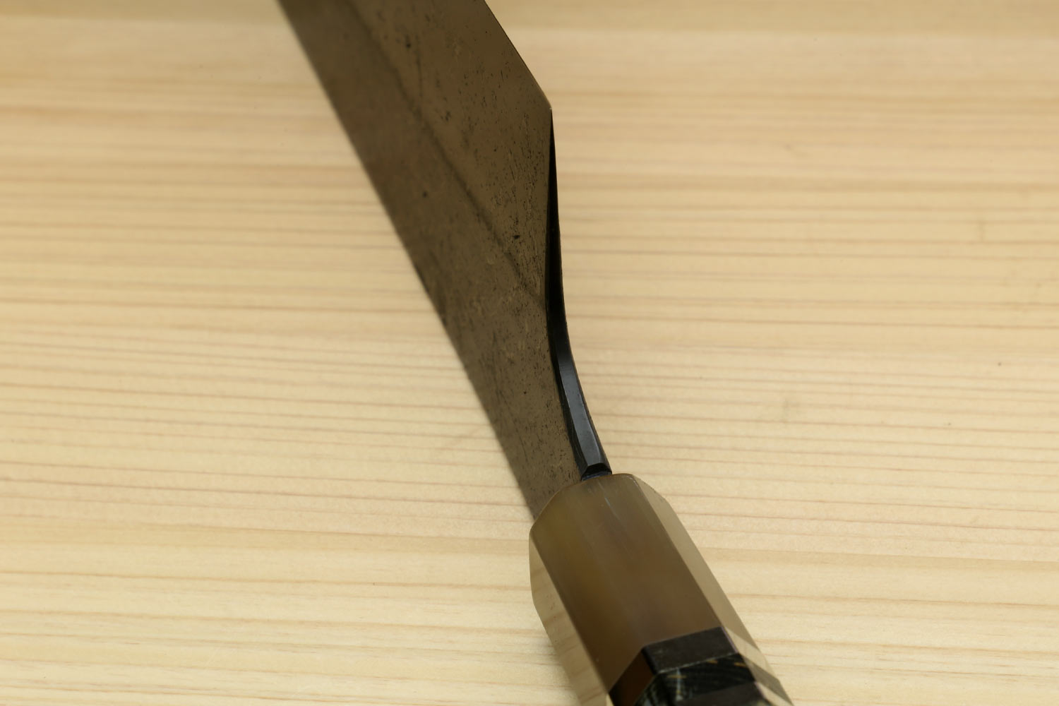 Nakiri vegetable knife handle and blade tip with dark metal and beveled edge