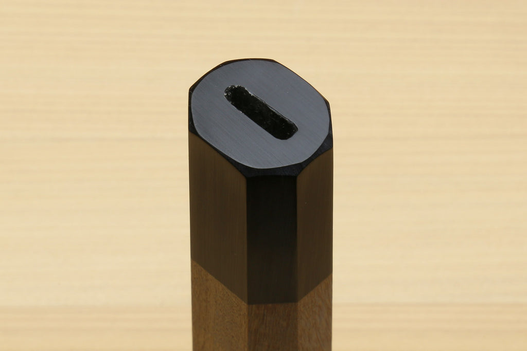 Gyuto chef knife handle end with ebony bolster and ambrosia wood body