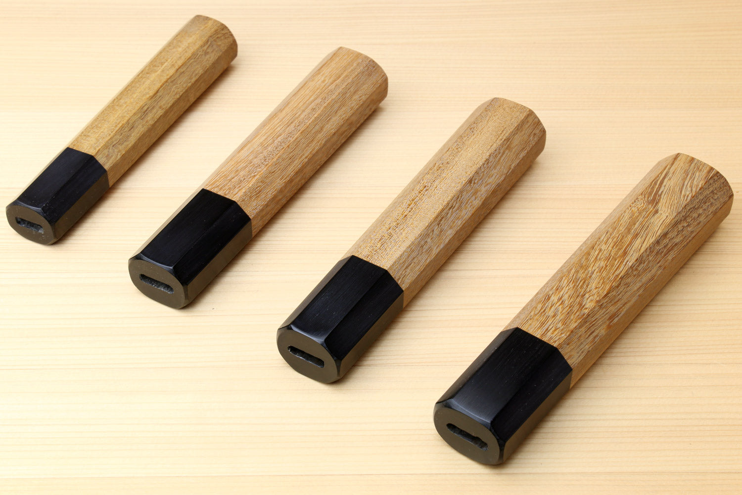 Set of wooden petty knife handles with ebony bolster ends, ambrosia wood, side view