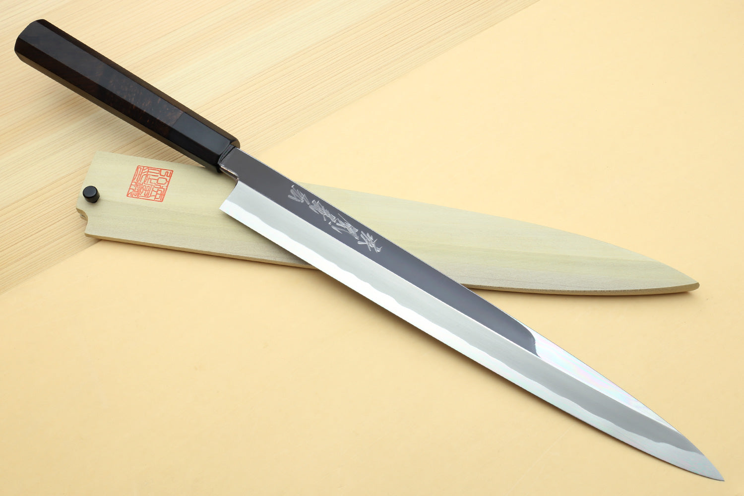 Japanese sushi sashimi knife with mirror-polished blue steel blade and ebony handle