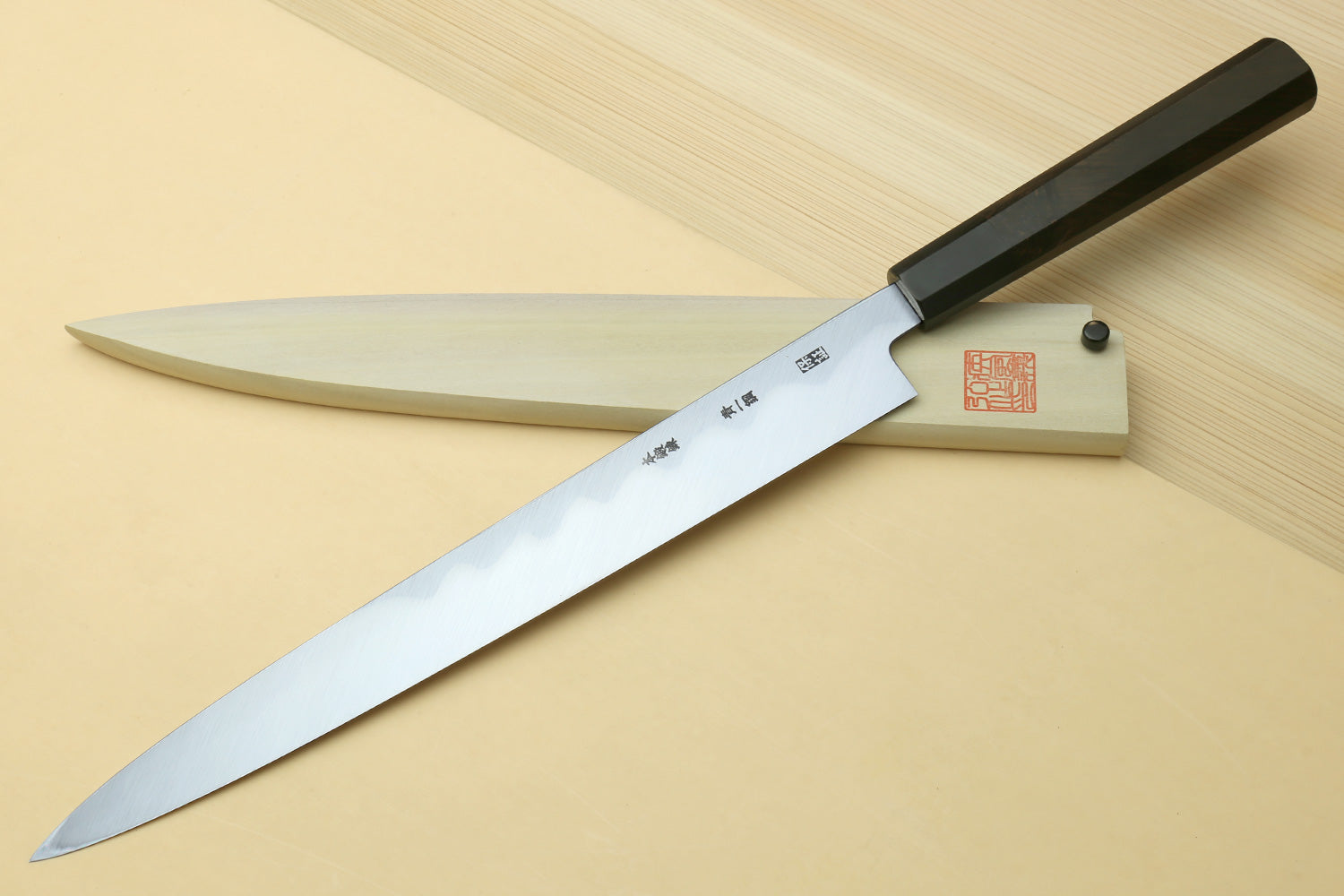 Japanese sushi sashimi knife with mirror-polished steel blade and ebony handle