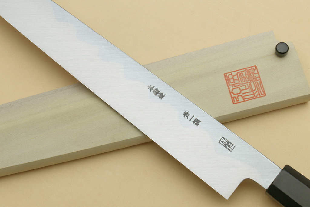 Japanese sushi sashimi knife side view, mirror-polished blade with ebony handle