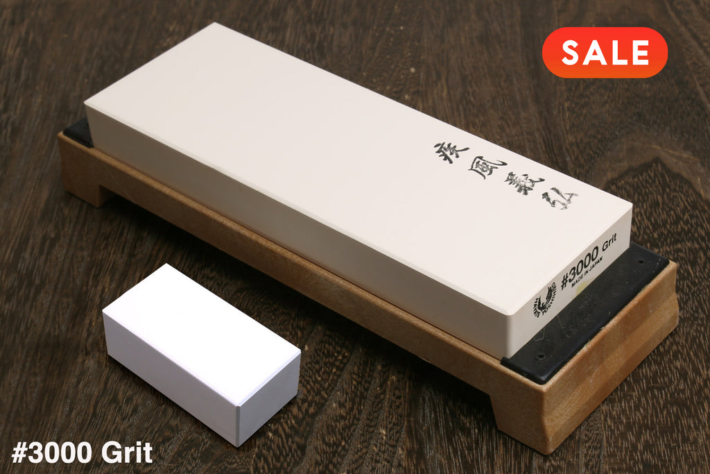 3000-grit whetstone sharpening stone with white block and wooden base