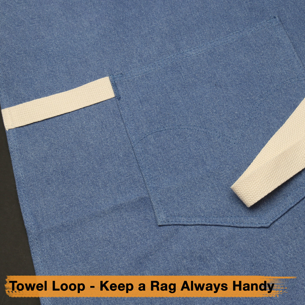 Light blue denim apron with front pocket, cream neck straps, and belt ties