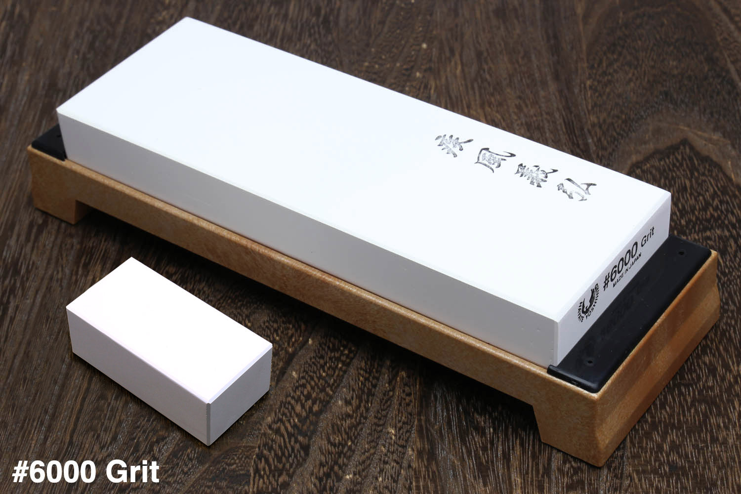 Whetstone (#6000 grit) on wooden base with small white nagura block
