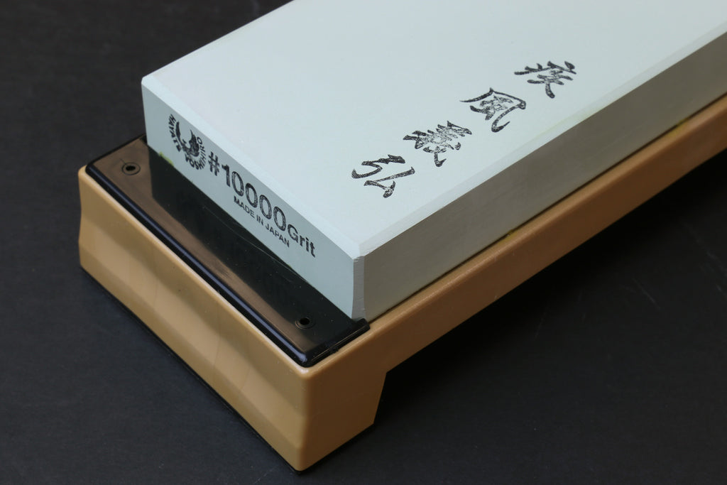 10,000-grit whetstone with grit text on pale green stone, on base