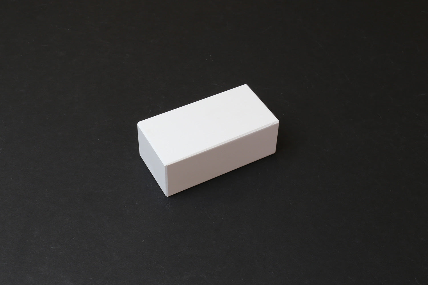 Rectangular white conditioning stone block with smooth edges