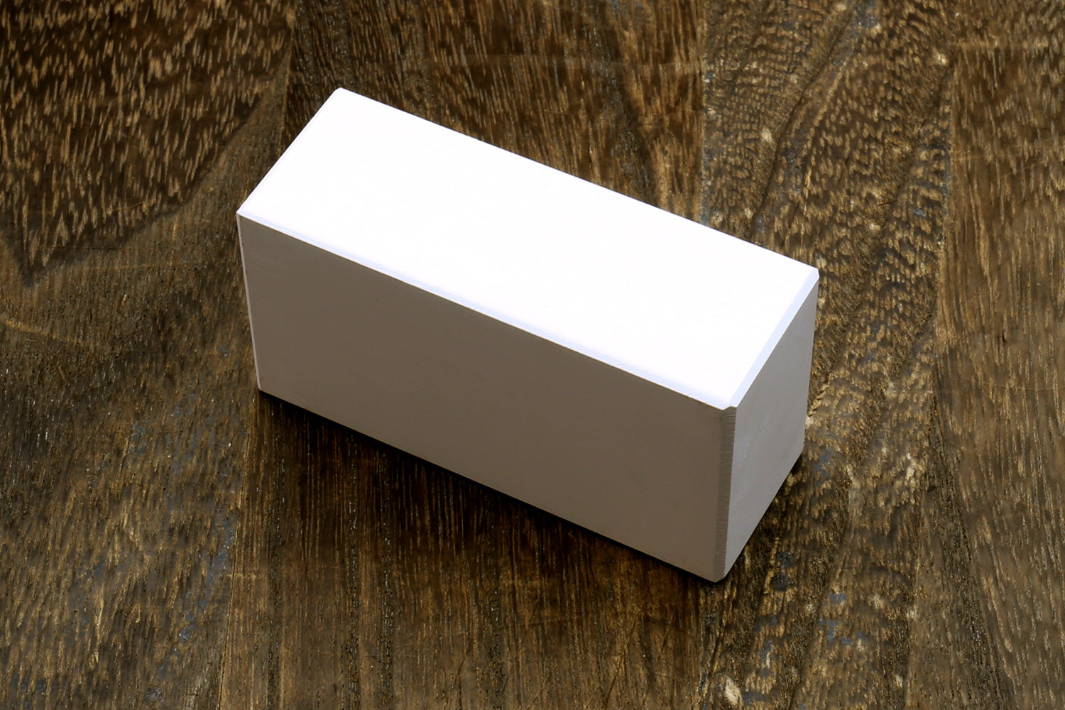 Rectangular conditioning stone block, white top with gray side faces