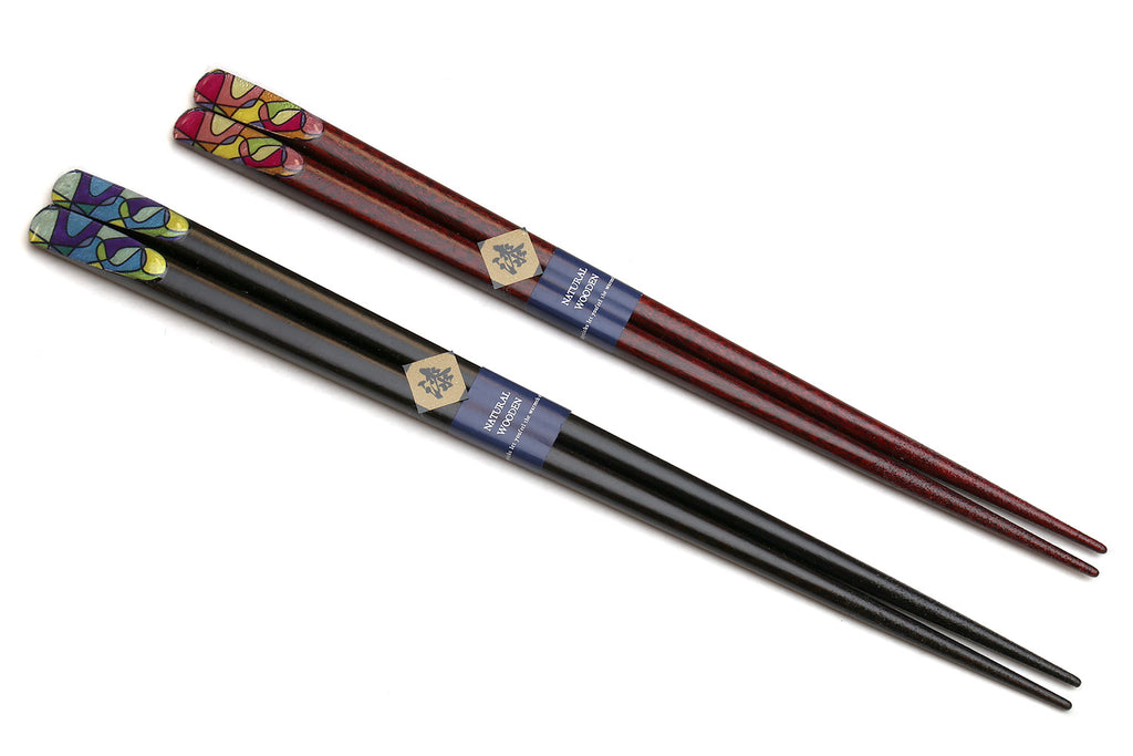 Lacquered chopsticks with retro graphic tips, dark finish and blue band.