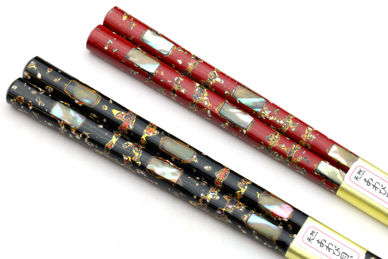 Pair of Japanese chopsticks with gold speckled abalone shell motif, red and black
