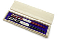Japanese chopstick set in wood case with red and black chopsticks, decorative ends