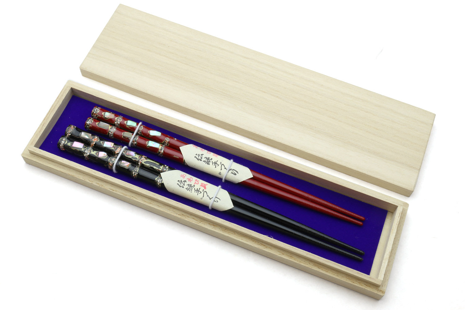 Japanese chopstick set in wood case with red and black chopsticks, decorative ends