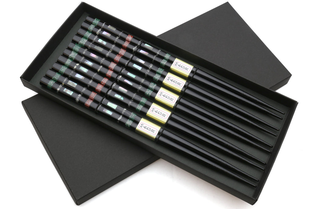 Black chopsticks set of 5 in open box, with green and red mosaic pattern