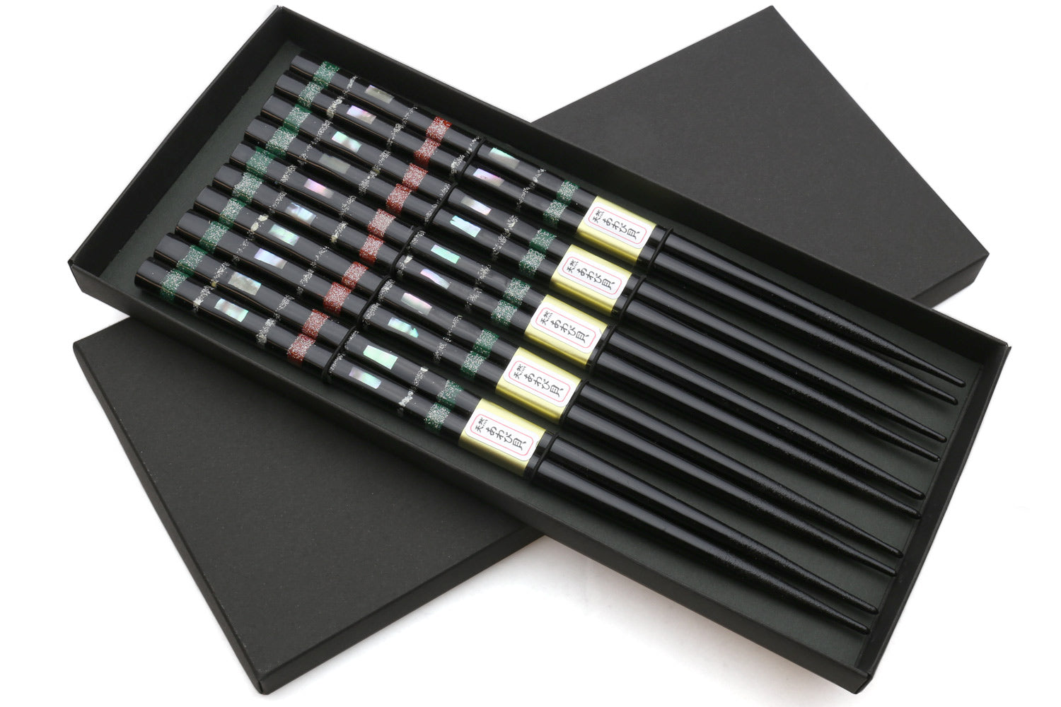 Black chopsticks set of 5 in open box, with green and red mosaic pattern