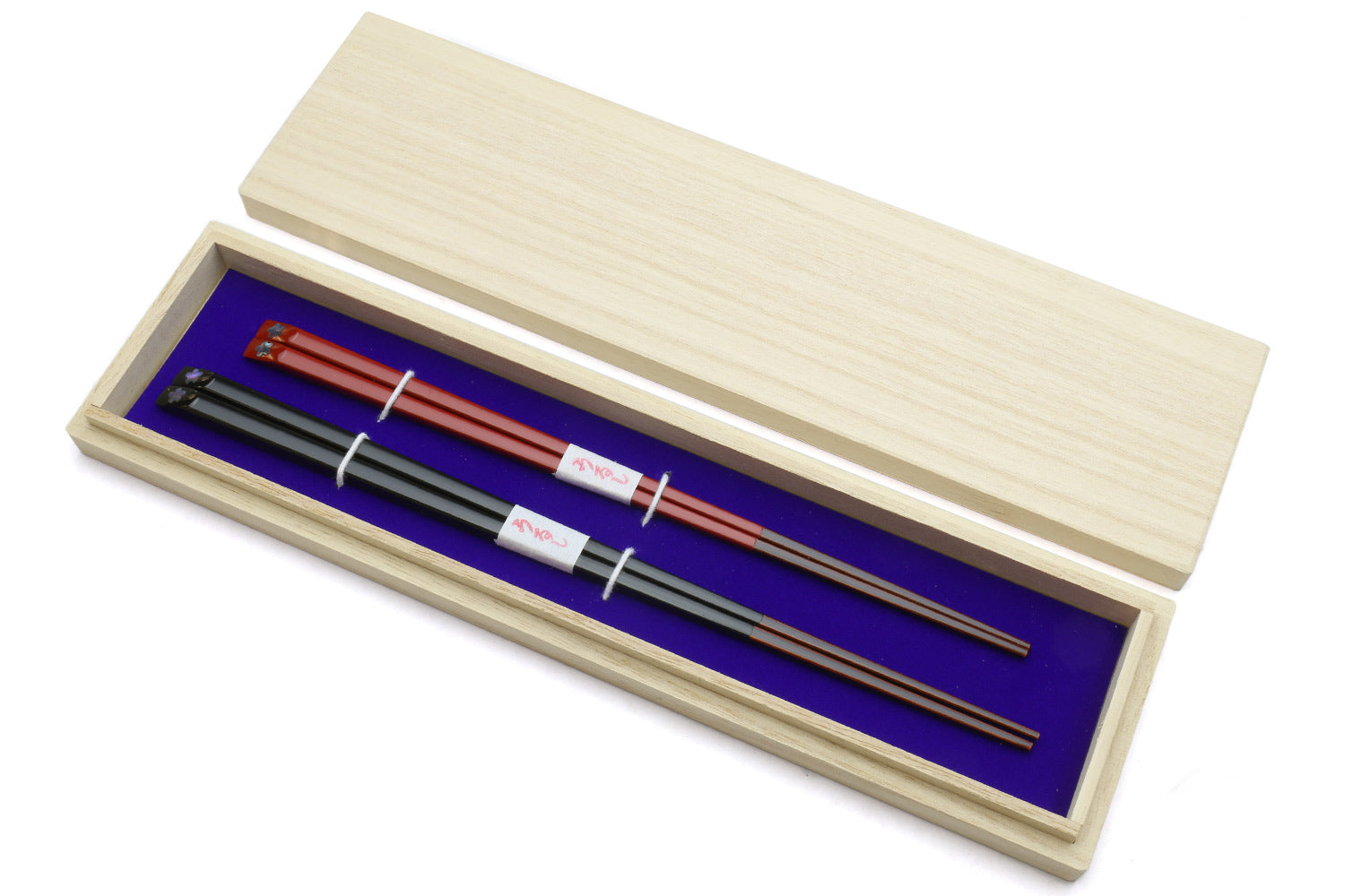 Chopsticks set in light wood case with black and red pair
