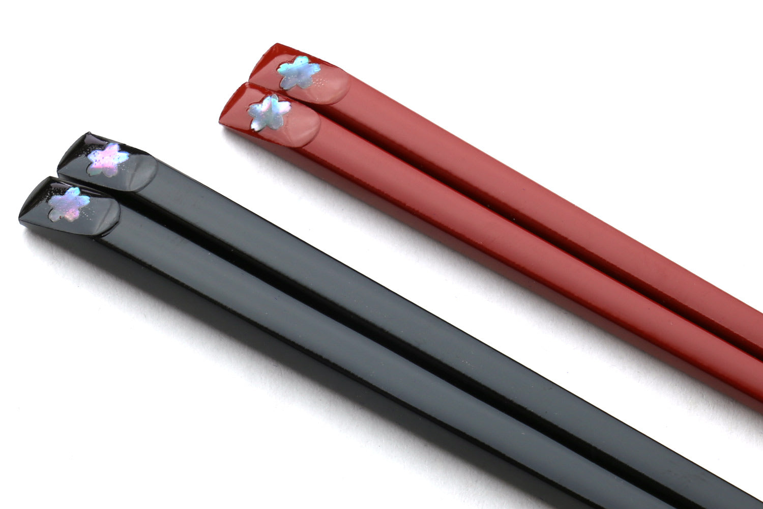Red and black chopsticks with pink flower end caps