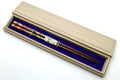 Chopstick pair in a light wood presentation box with blue interior