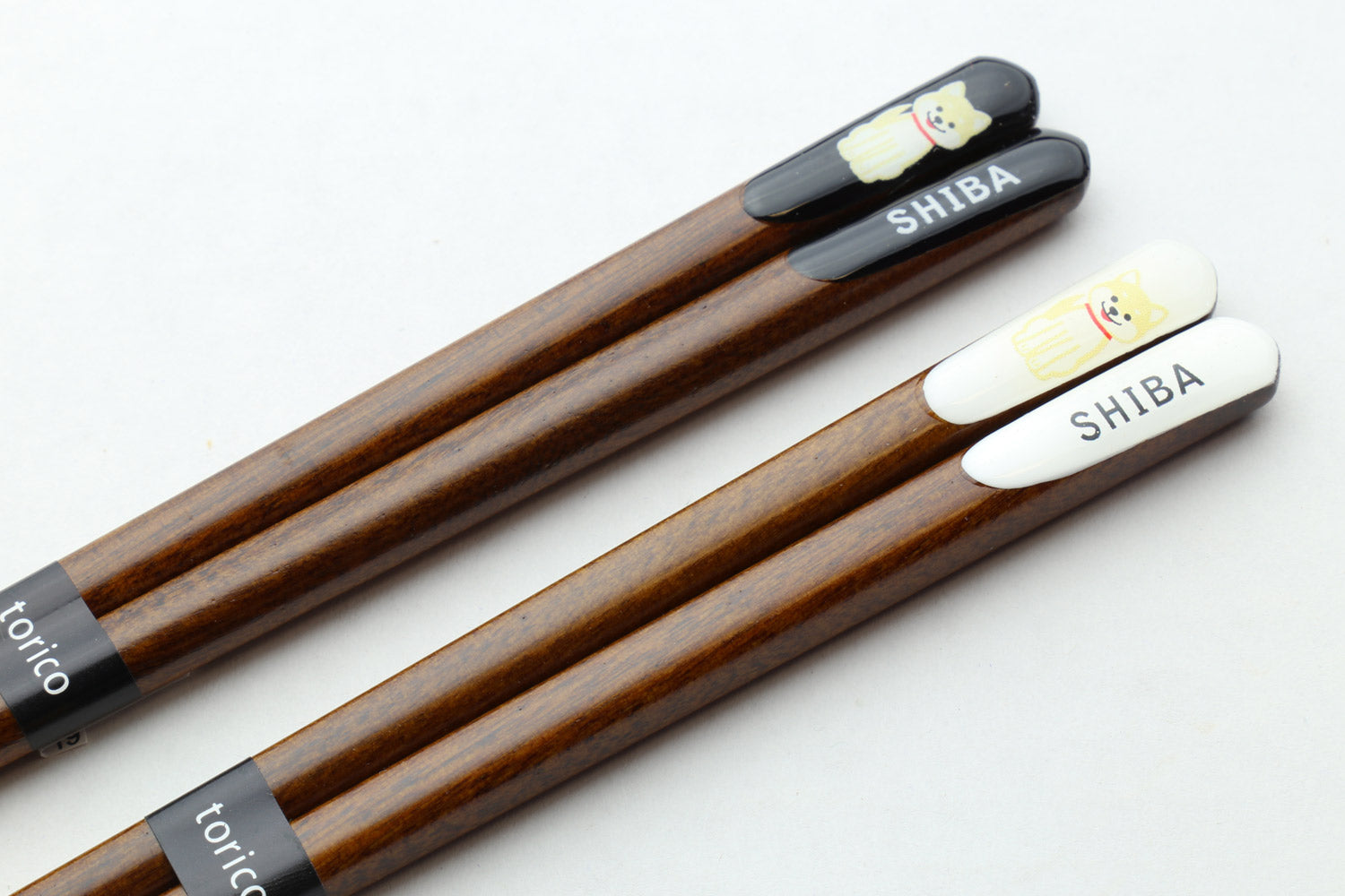 Lacquered chopsticks with white and black shiba end caps labeled SHIBA