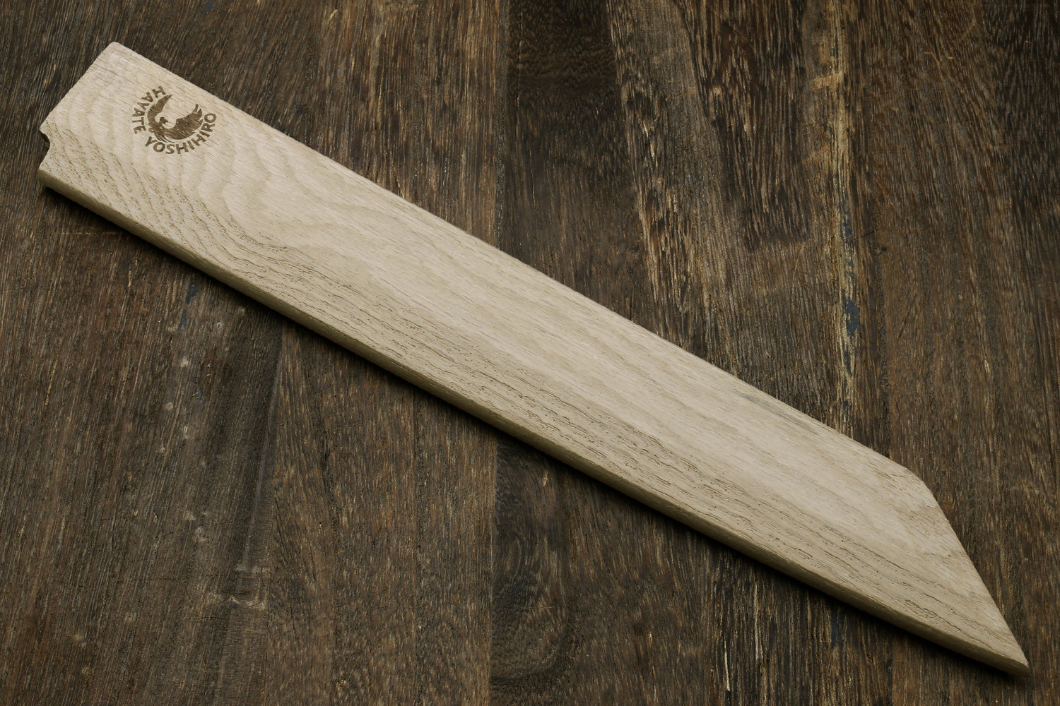 Magnetic wooden saya cover, light oak color with brand logo, angled view