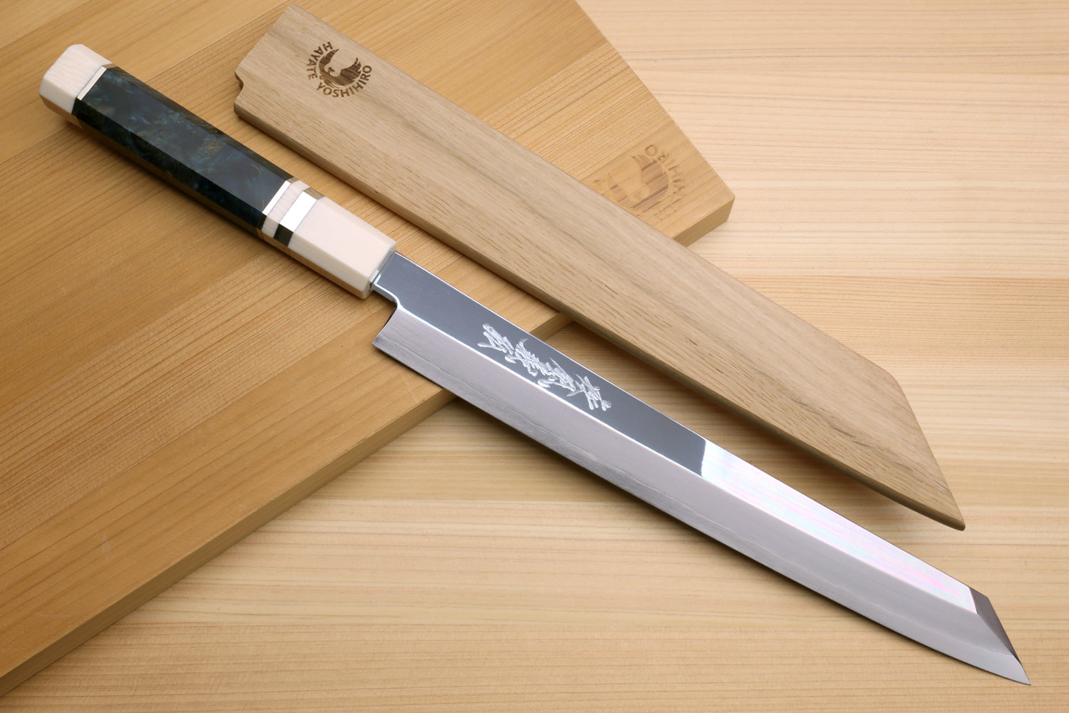 Japanese yanagi knife with stainless blade and dark handle with ivory bolster