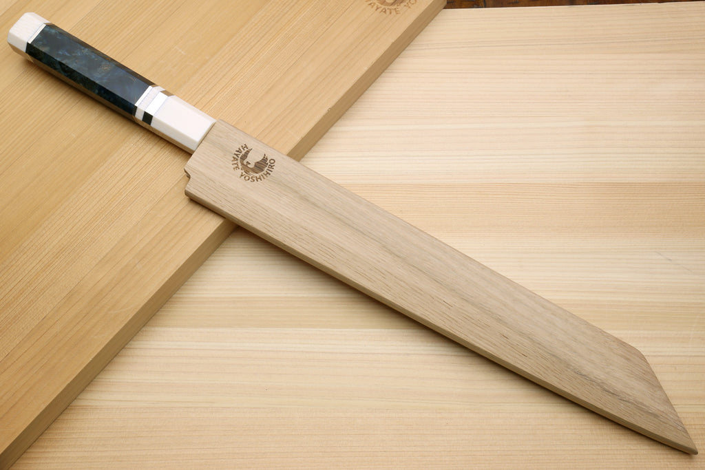 Japanese sashimi knife with polished blade, dark grip, and ivory handle