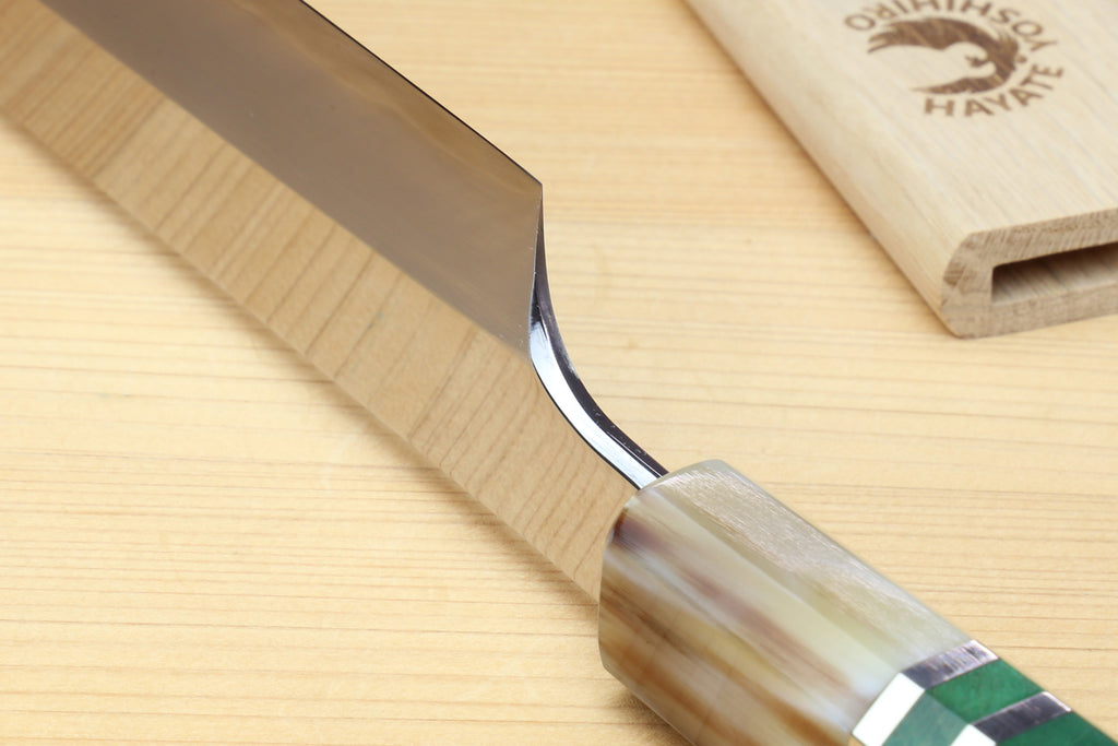 Japanese sushi knife with curved stainless steel blade tip and green-accent handle