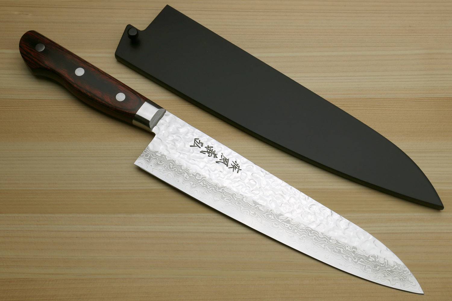 Damascus gyuto chef knife with black blade cover and dark wood handle