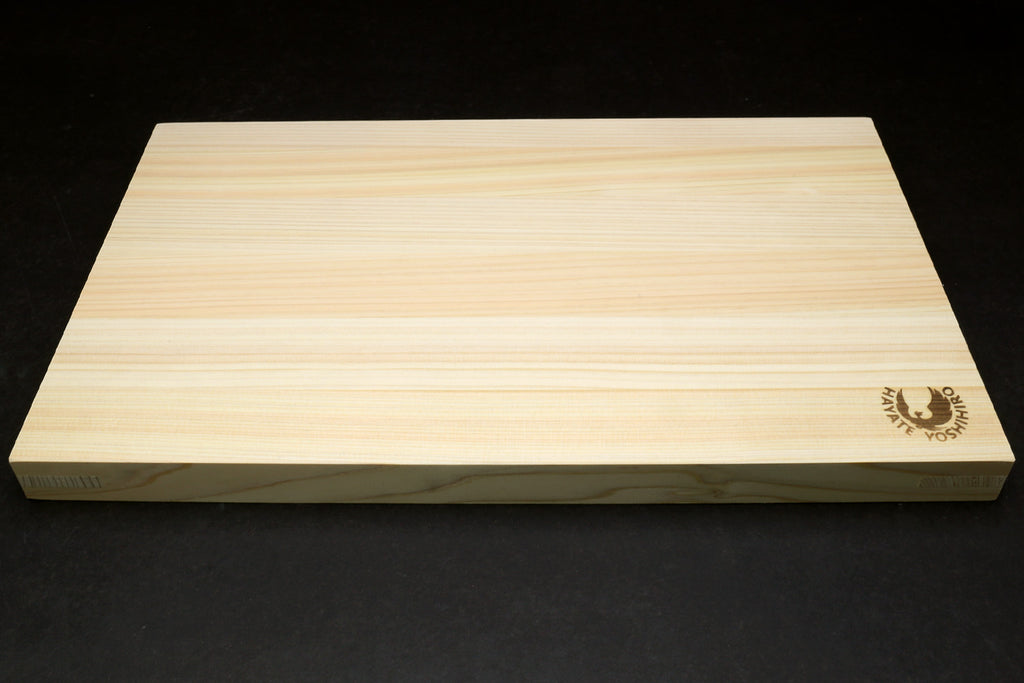 Japanese cypress cutting board side profile with Yoshihiro logo near corner