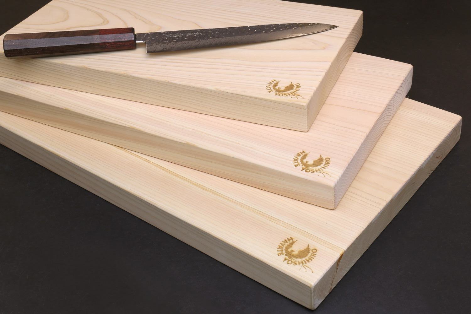 Hinoki cypress cutting board with knife, stacked one-piece planks and gold logos