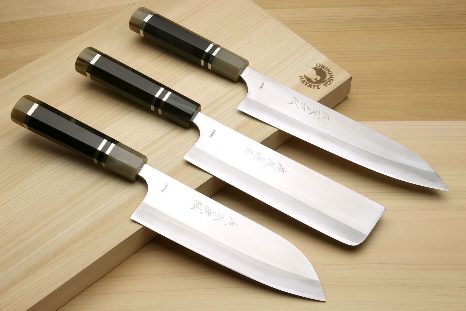 3-piece Japanese knife set with dark octagonal handles and triple-ring trim