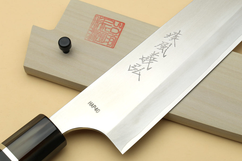 Japanese HAP40 knife blade with engraved kanji on steel and dark octagonal handle