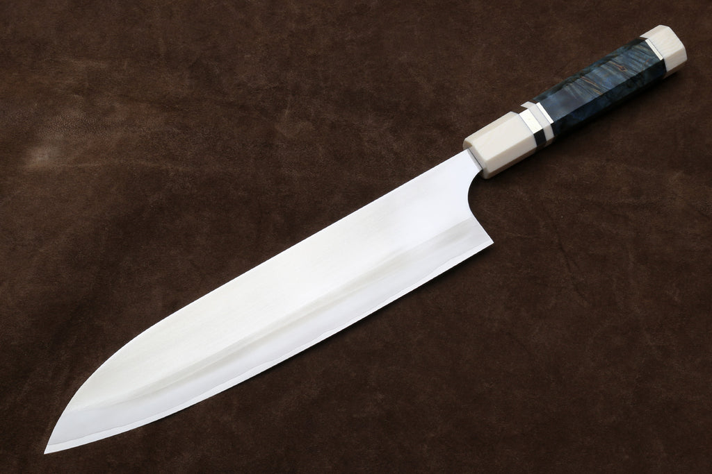 Gyuto chef knife with curved edge, silver blade and octagonal ivory handle with dark band