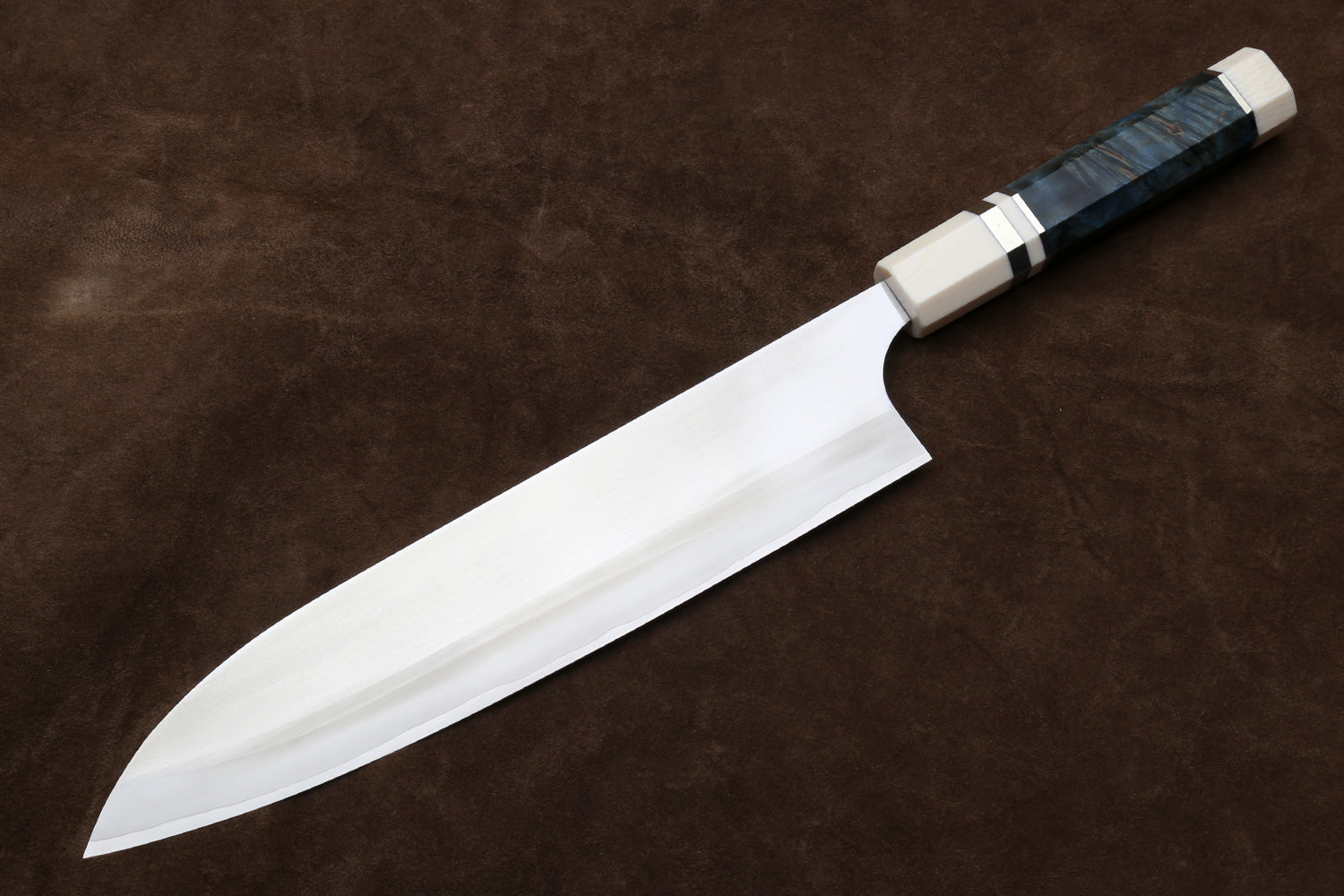 Gyuto chef knife with curved edge, silver blade and octagonal ivory handle with dark band