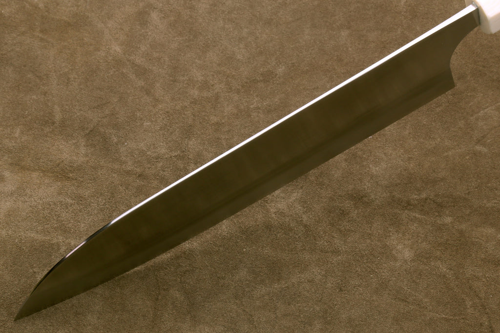 Gyuto chef knife side view, silver blade with smooth spine, ivory handle and bolster