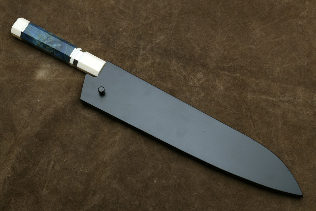 Gyuto chef knife with long silver blade and octagonal ivory handle, dark bolster