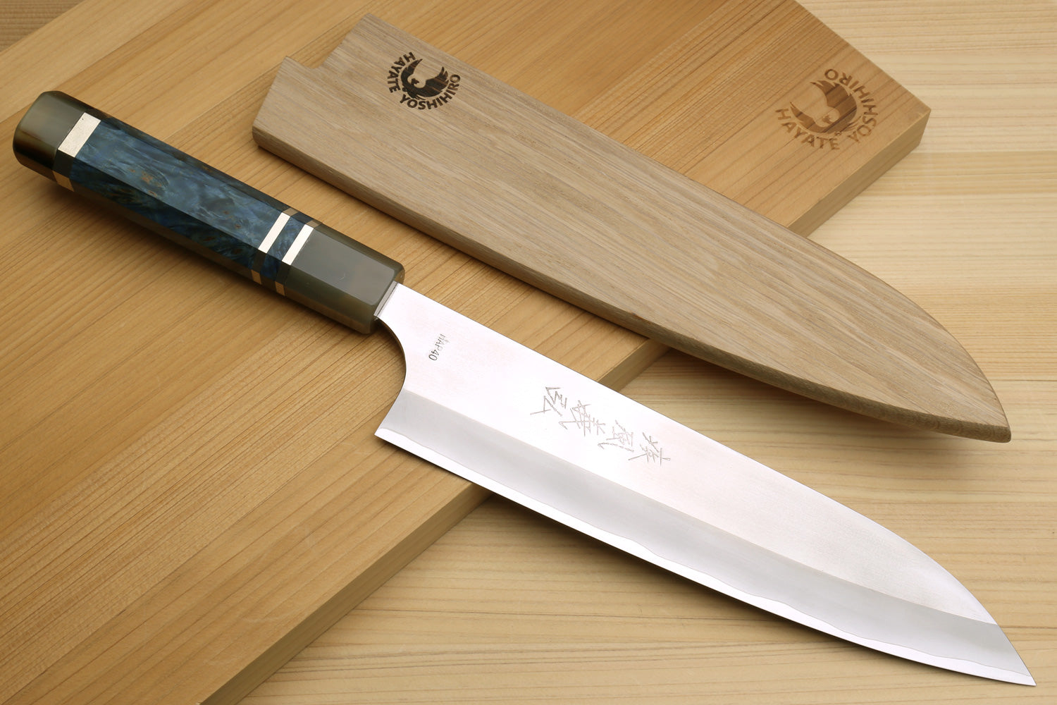 Gyuto chef's knife with ocean blue handle and light wood saya cover