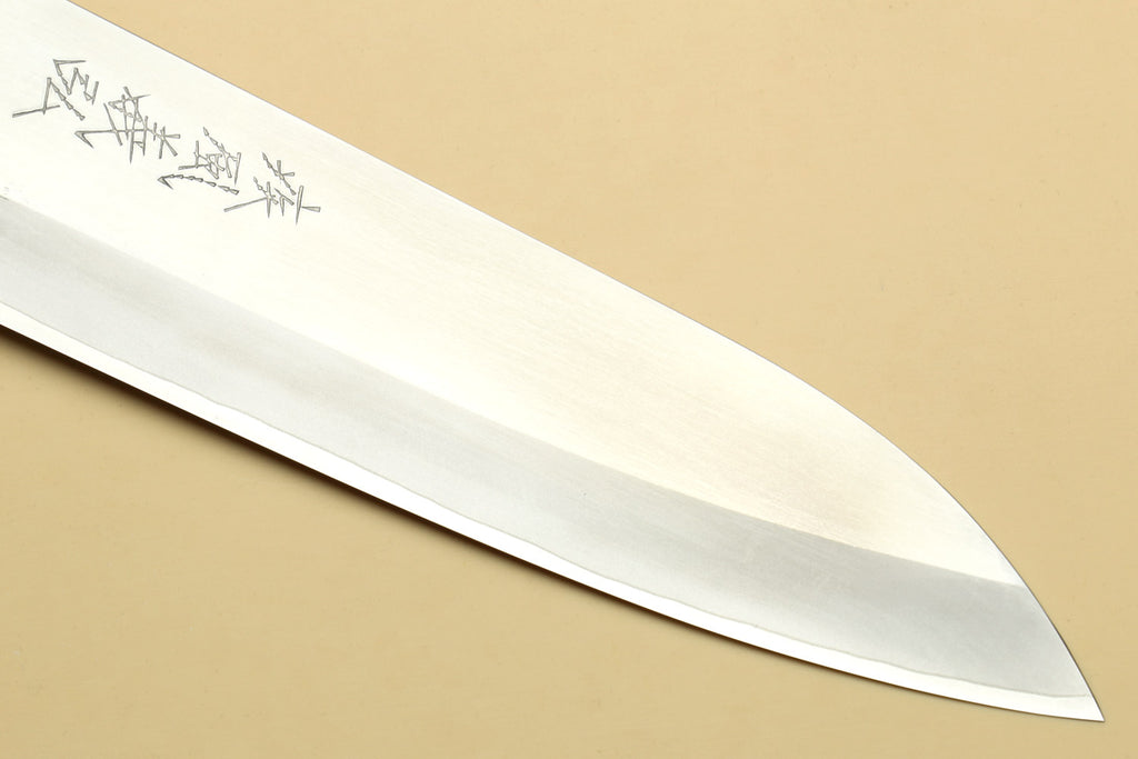 Chef knife blade with smooth edge and shallow bevel