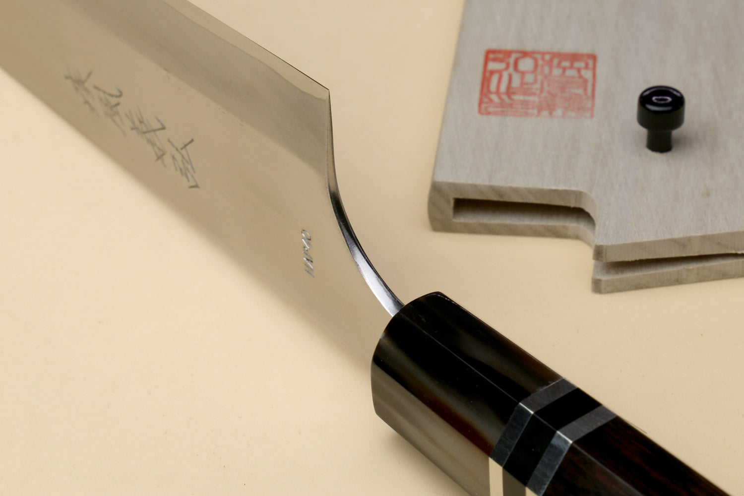 Chef knife with stainless blade and dark ebony triple-ring handle