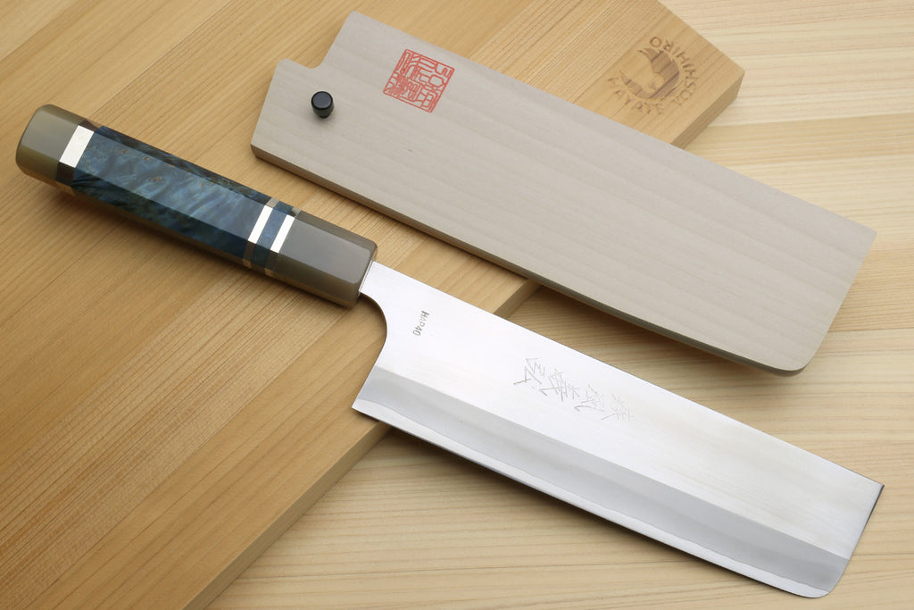 Nakiri knife with ocean blue handle beside magnolia saya cover