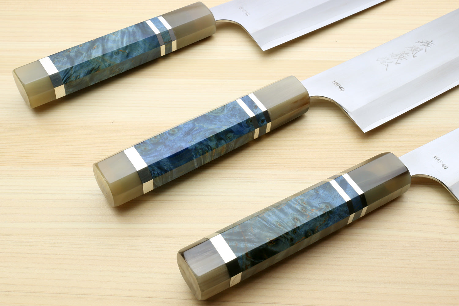 Nakiri knives with ocean blue patterned handles and matching magnolia saya