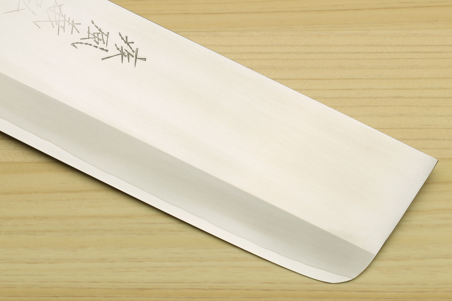 Nakiri vegetable chef knife blade with pointed tip and stamped characters