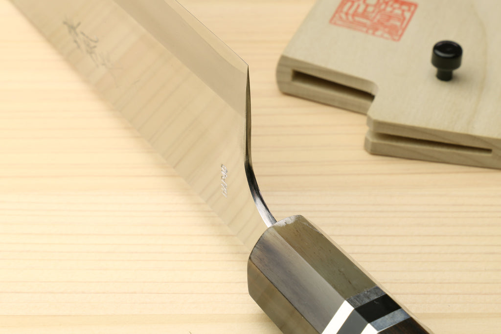 Nakiri vegetable chef knife with thin pointed tip and dark handle with ring accents