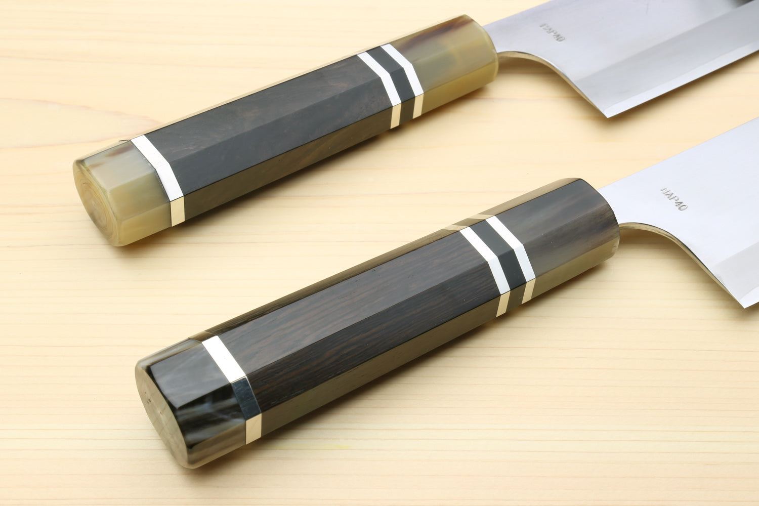 Nakiri vegetable chef knives with matching dark octagonal ebony handles and white blades