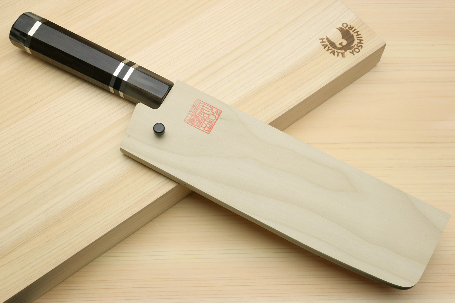 Nakiri vegetable chef knife with dark octagonal handle and straight edge blade