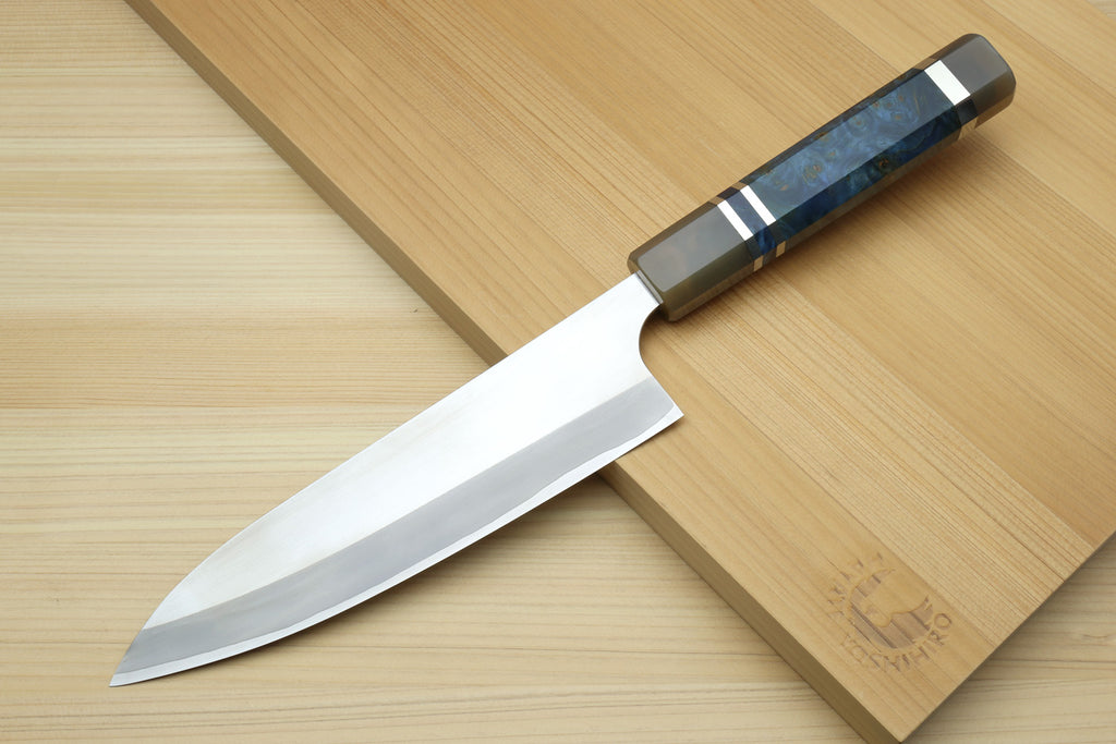 HAP40 petty chef knife with ocean blue handle and white blade on wooden board