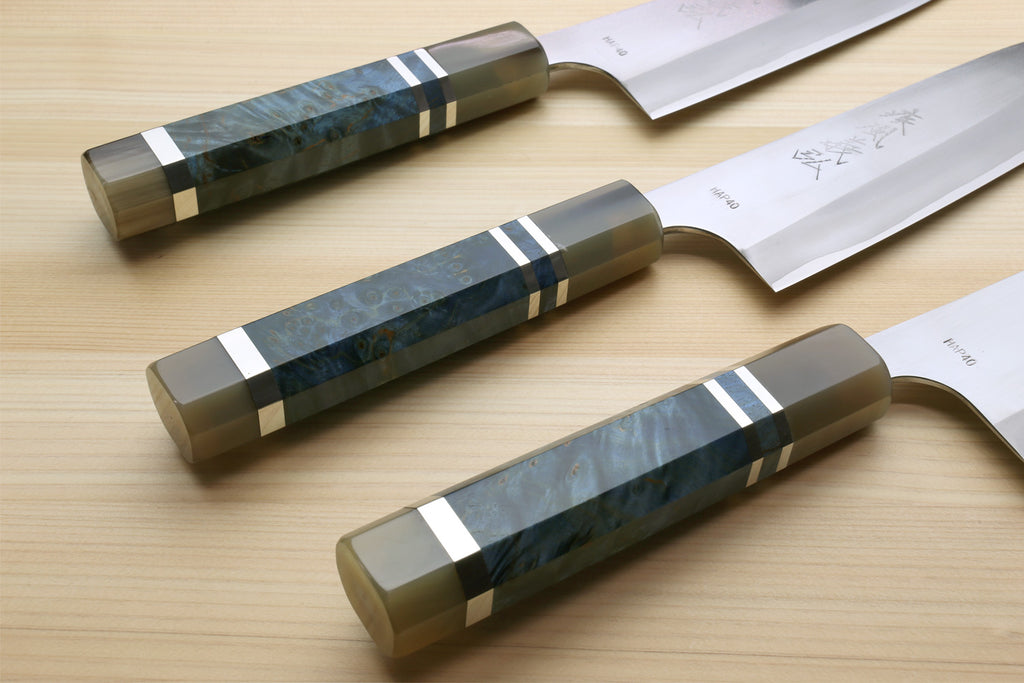 HAP40 petty chef knife with ocean blue handle, shown in three positions